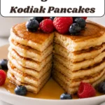 Kodiak cottage cheese pancakes cooking on medium heat until bubbles form on top
